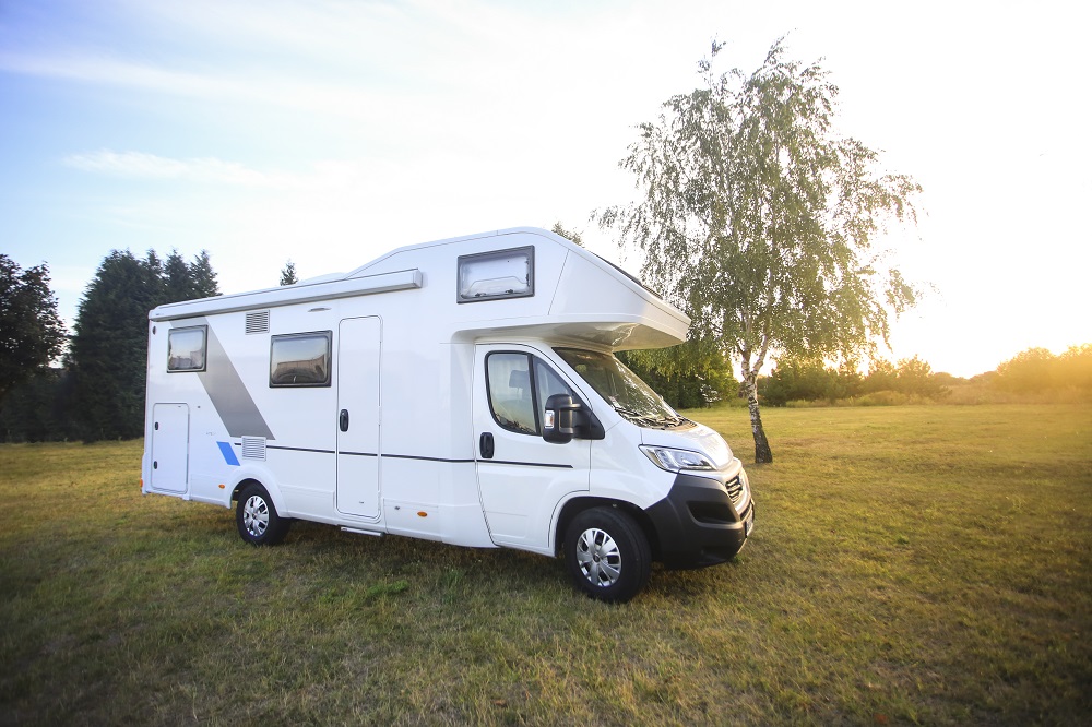 rv parked in a grass field